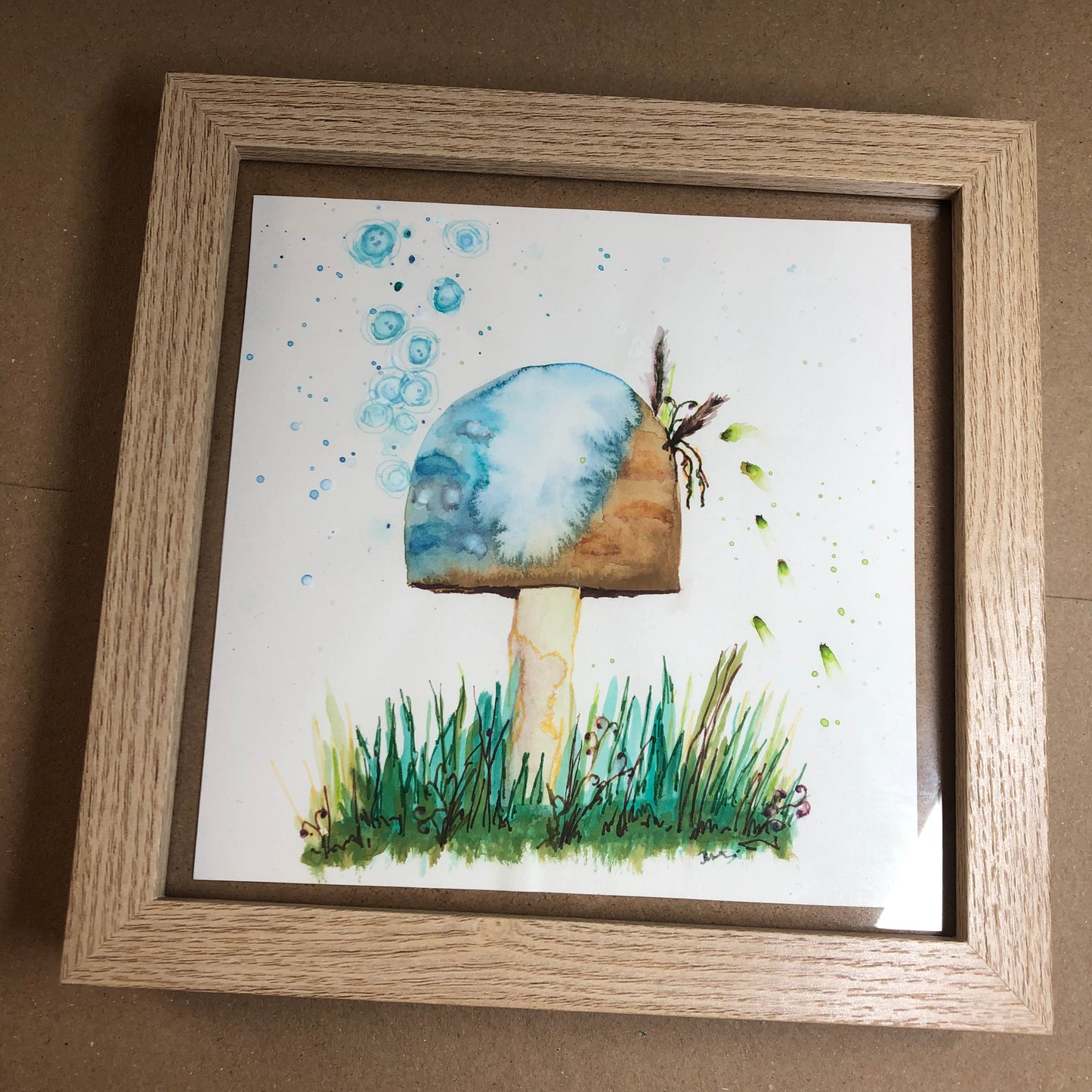 Blue and brown toadstool framed art