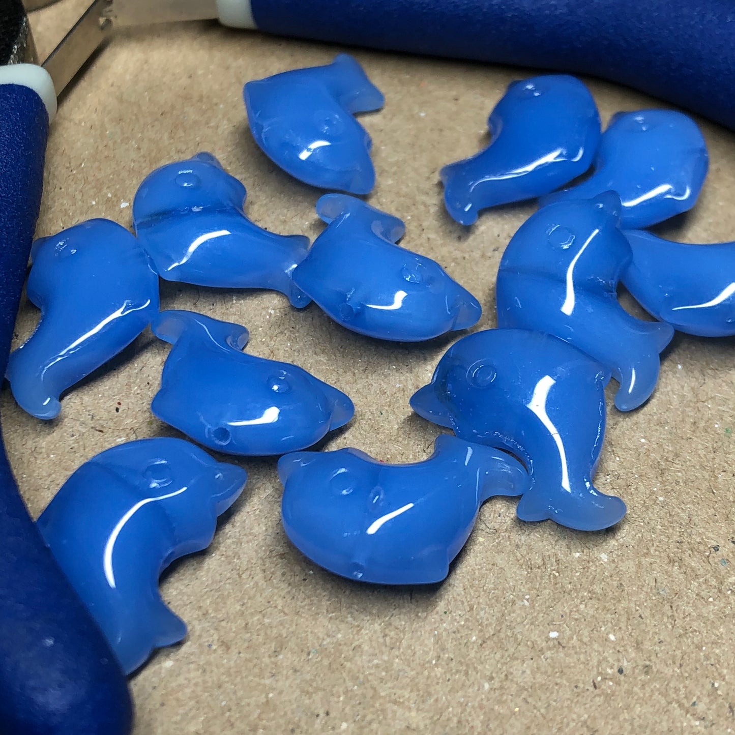 Blue opaque dolphin shaped glass beads