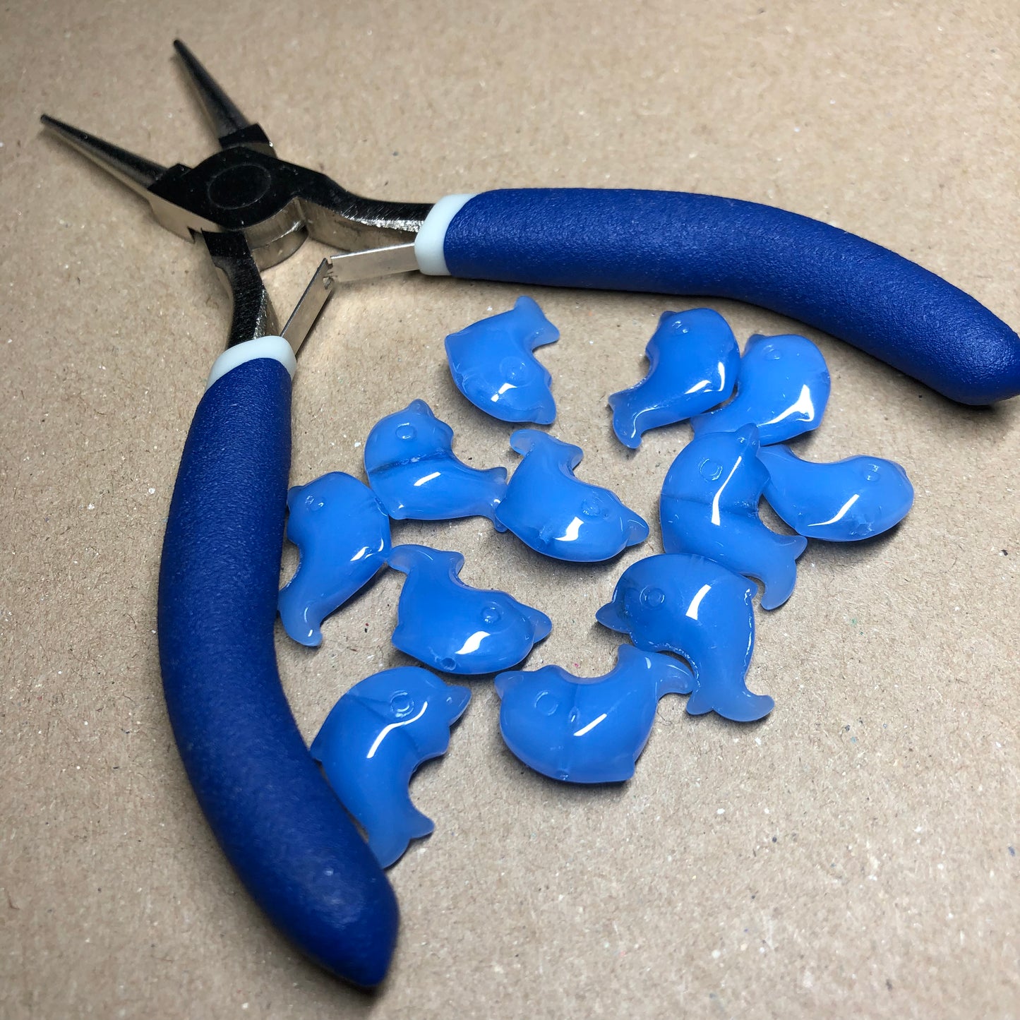 Blue opaque dolphin shaped glass beads