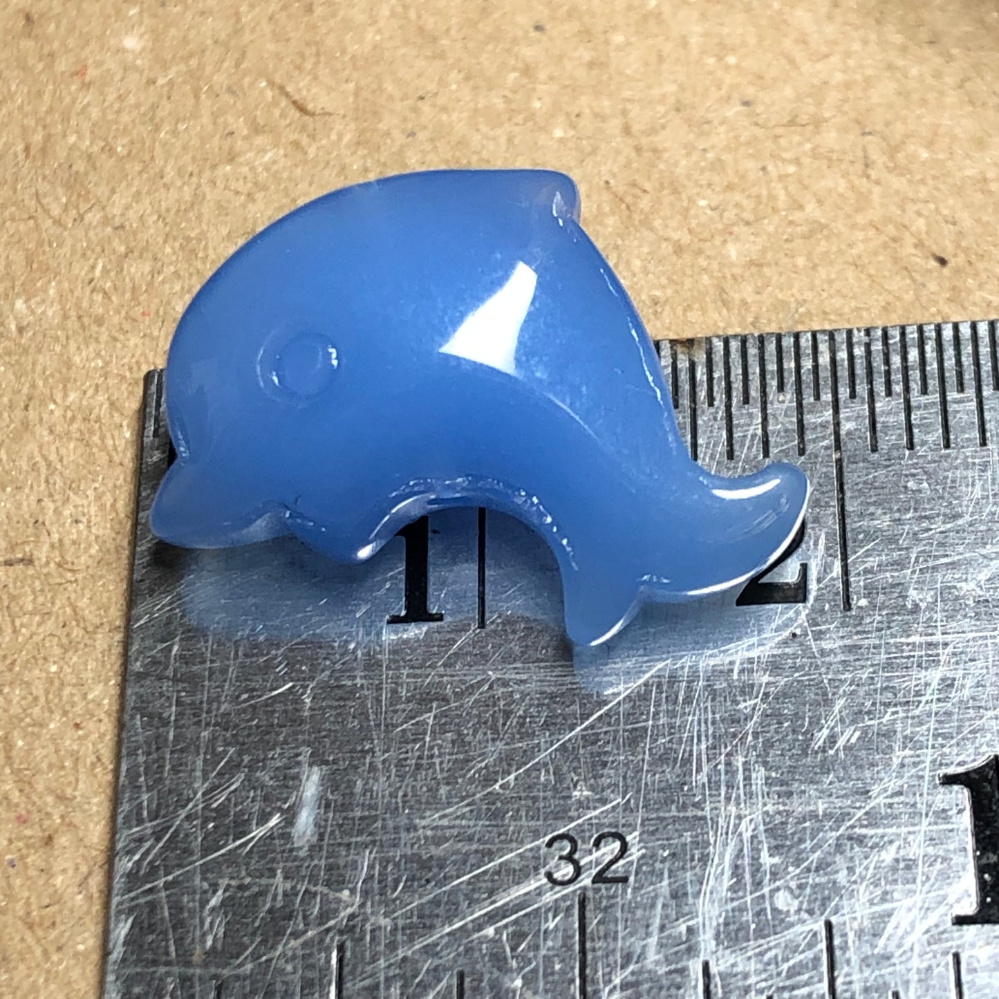 Blue opaque dolphin shaped glass beads