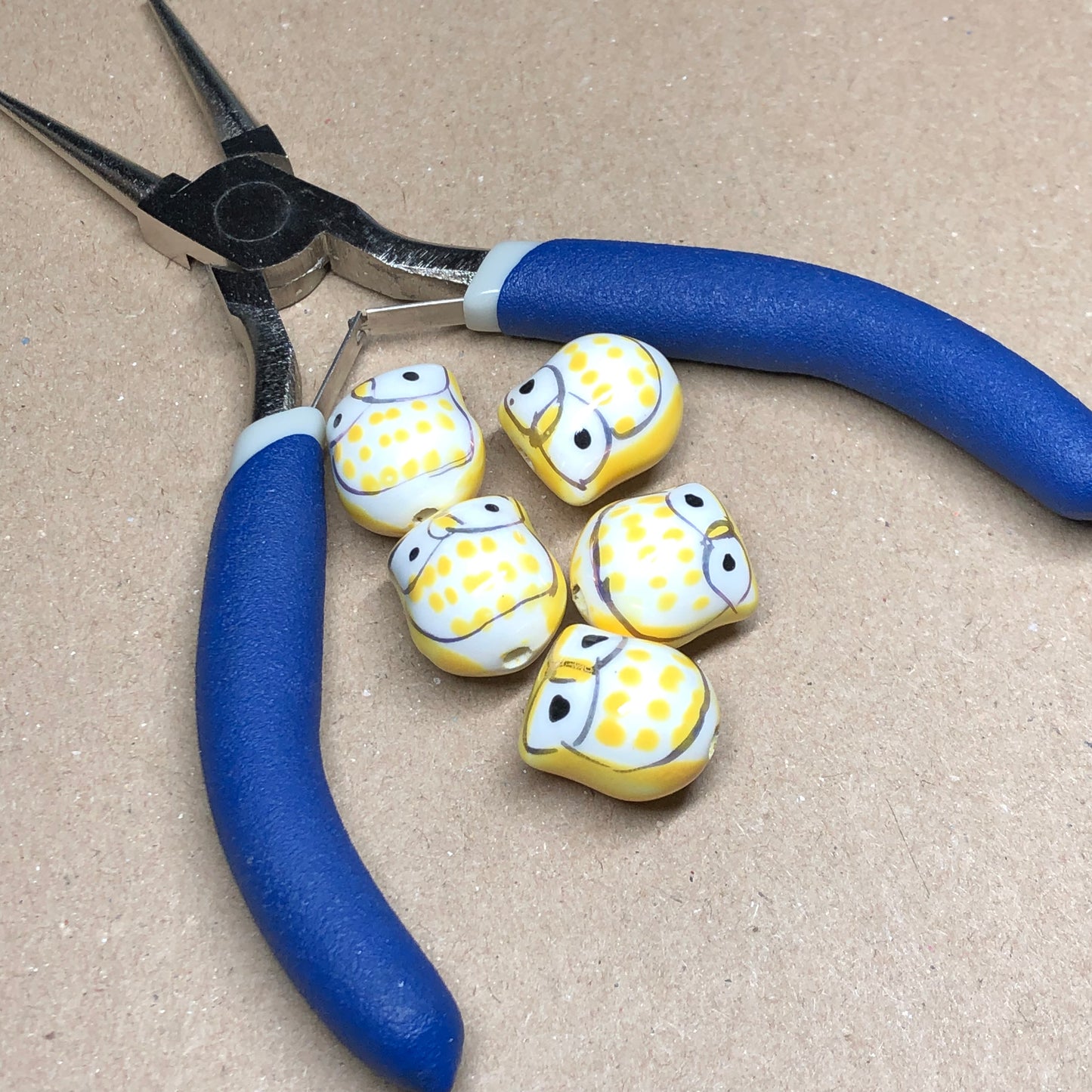 Yellow ceramic owl beads