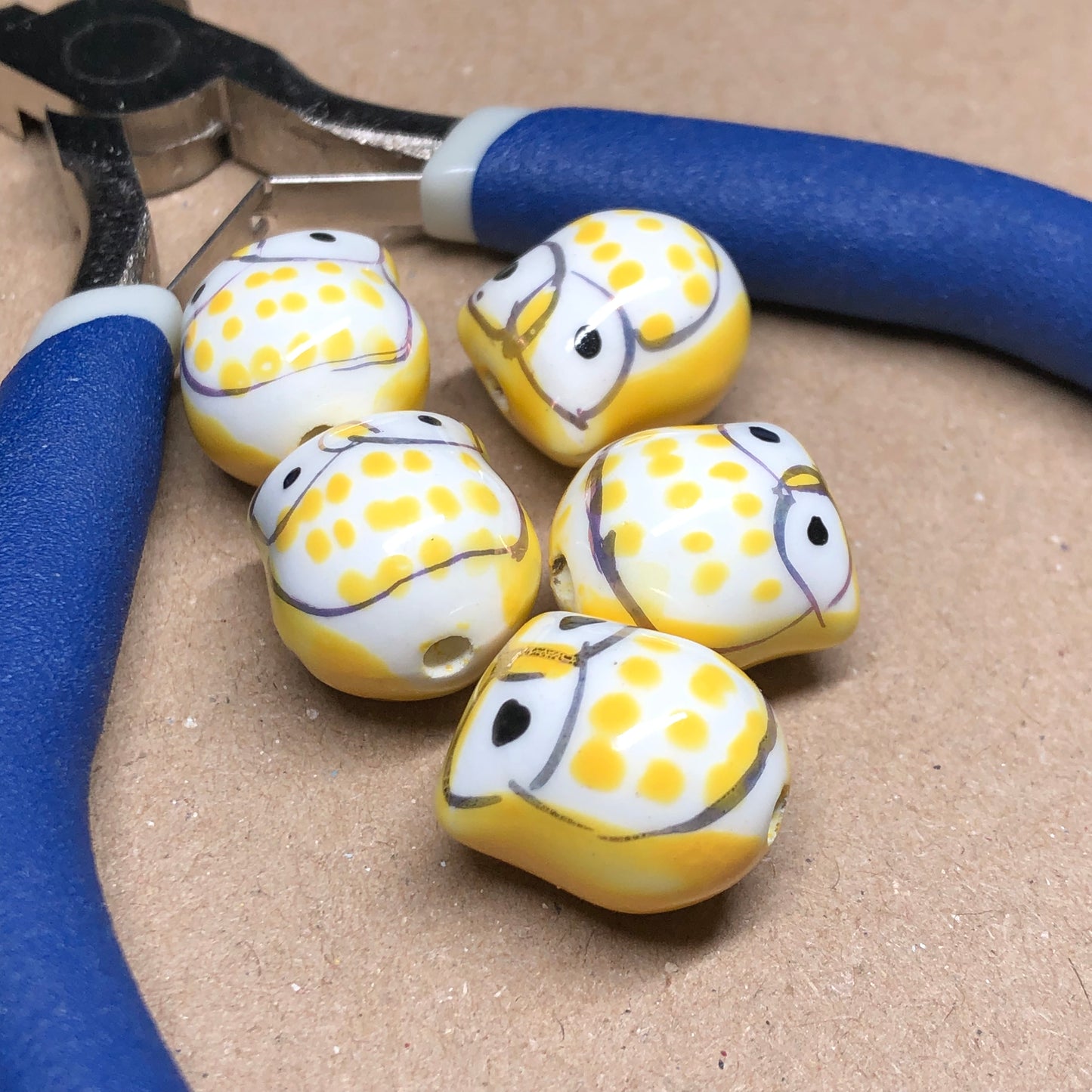 Yellow ceramic owl beads