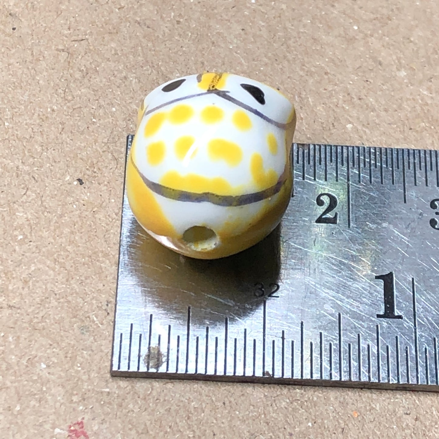 Yellow ceramic owl beads