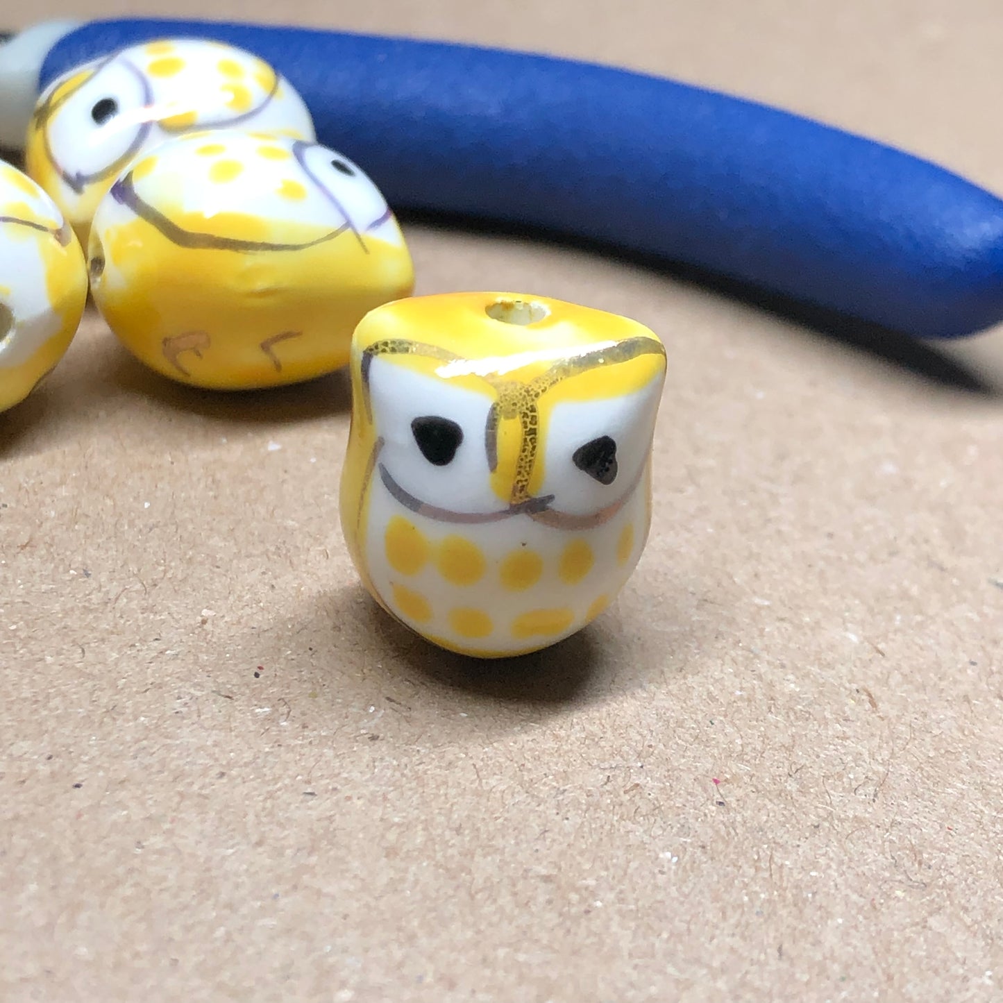 Yellow ceramic owl beads