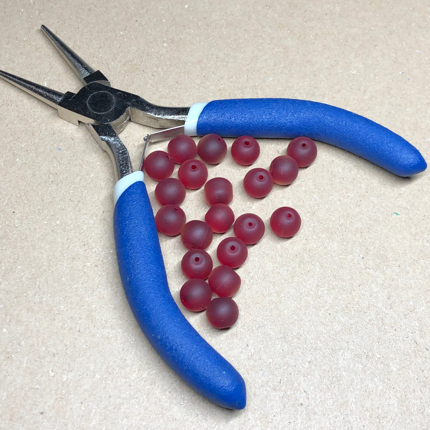 Frosted red glass beads