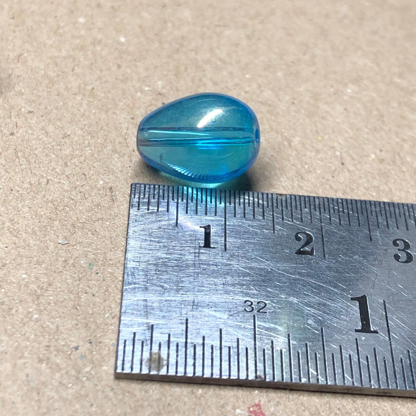 Iridescent blue teardrop shaped glass beads