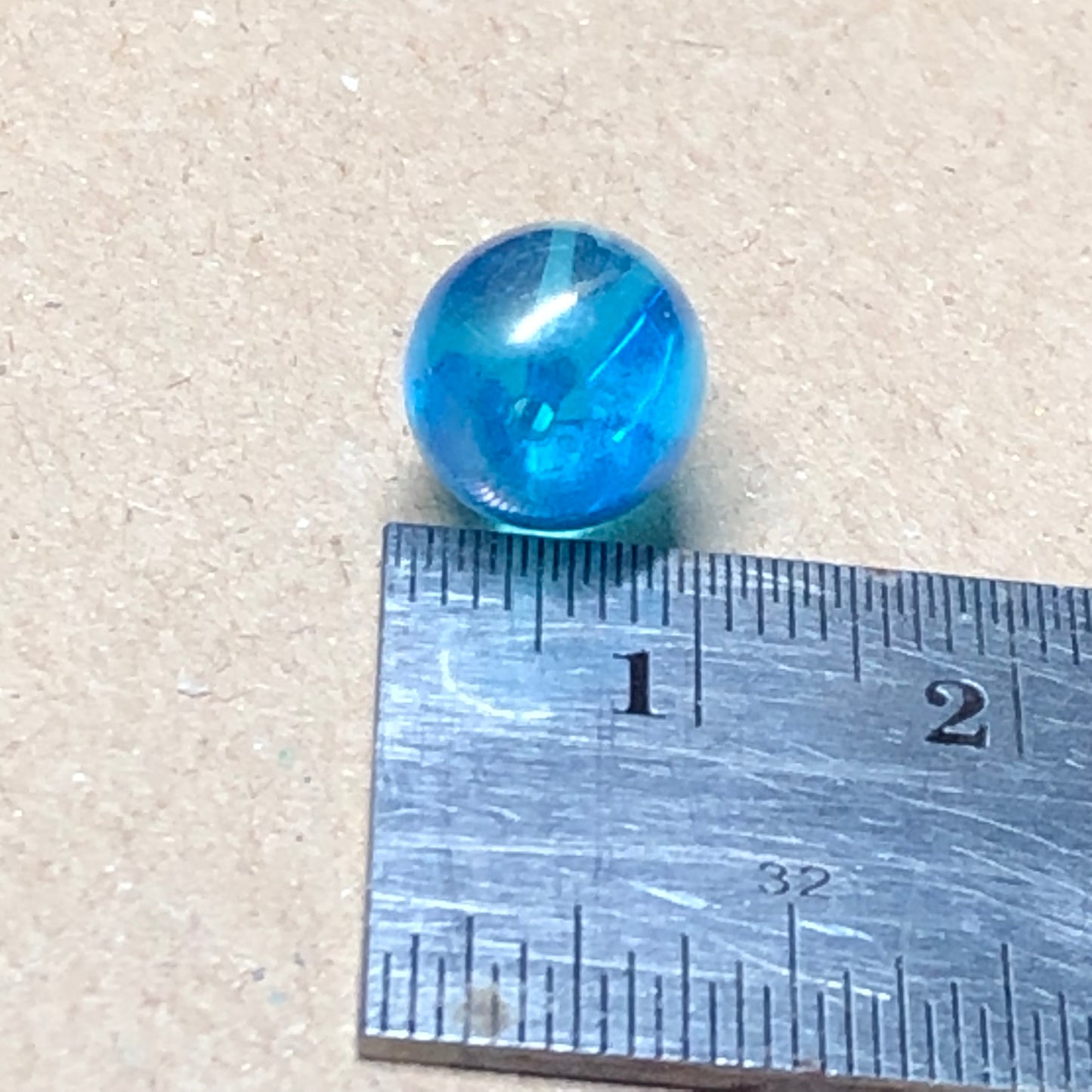 Iridescent blue teardrop shaped glass beads