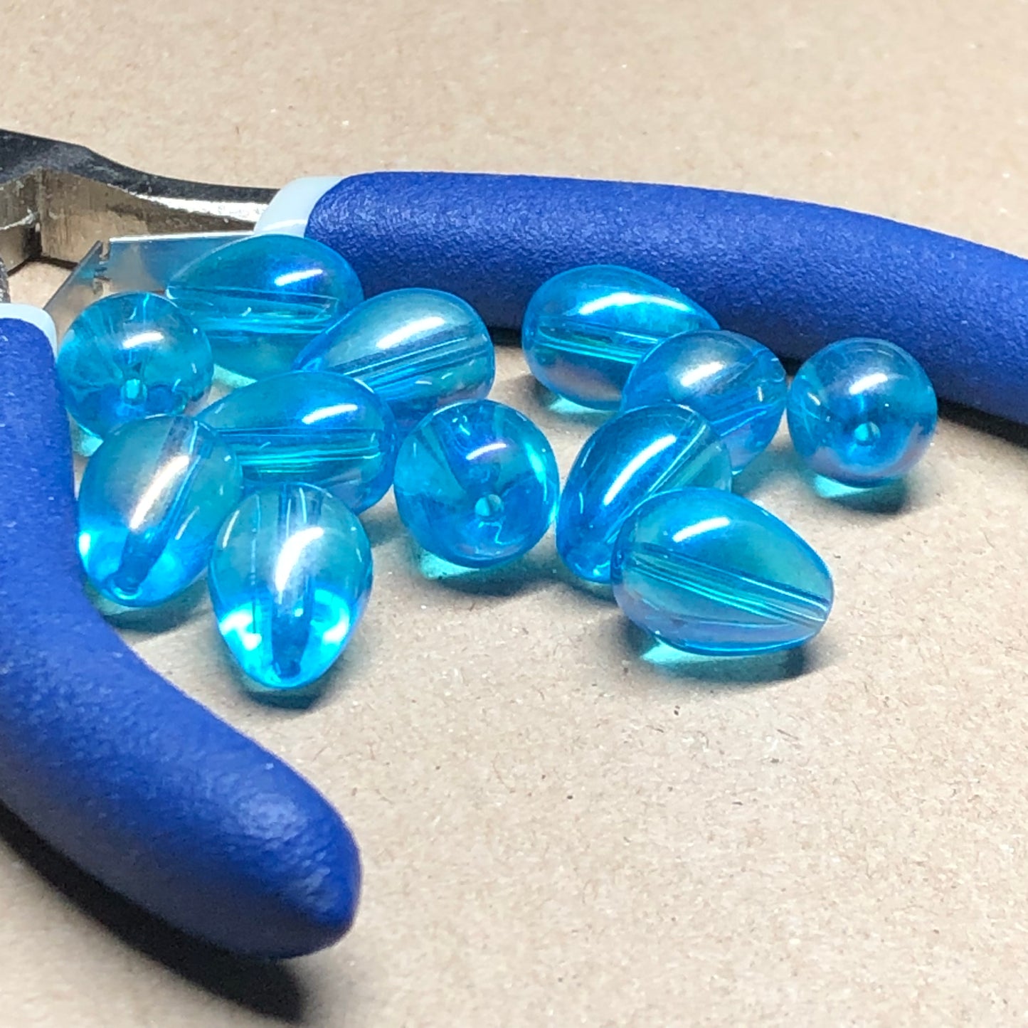 Iridescent blue teardrop shaped glass beads