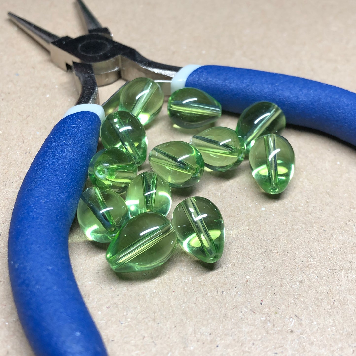 Green teardrop shaped glass beads