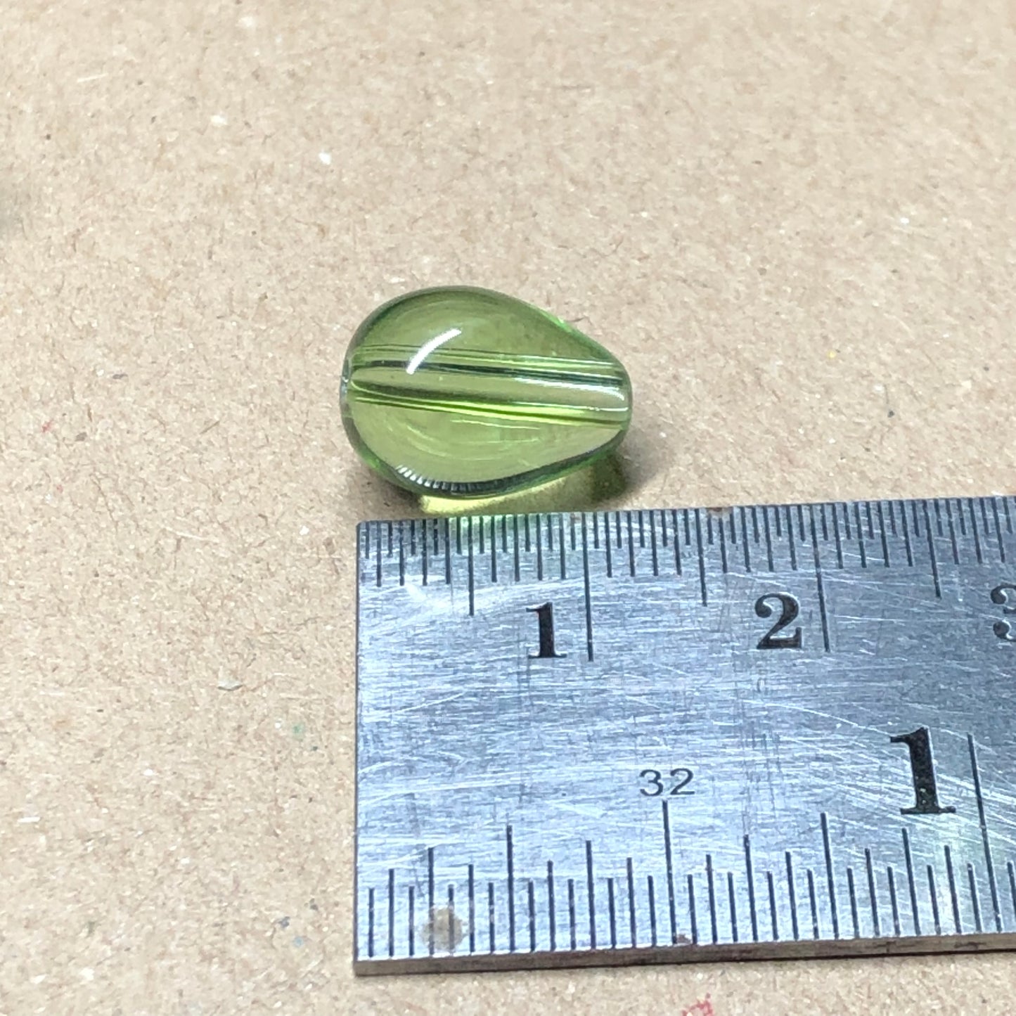 Green teardrop shaped glass beads