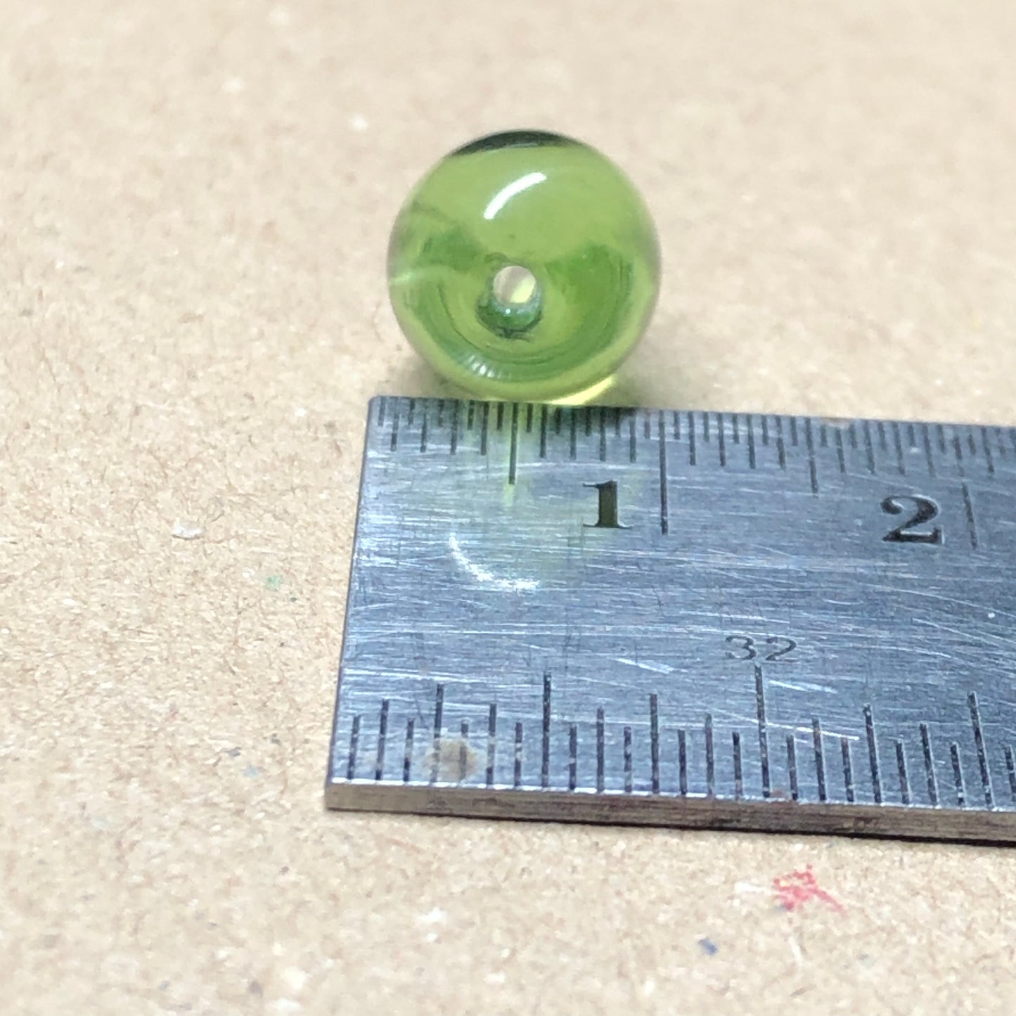 Green teardrop shaped glass beads