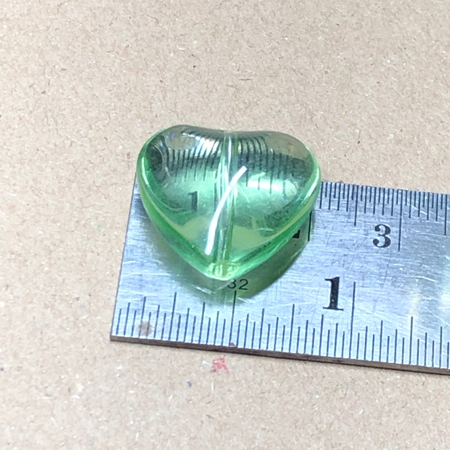 Large green glass heart beads