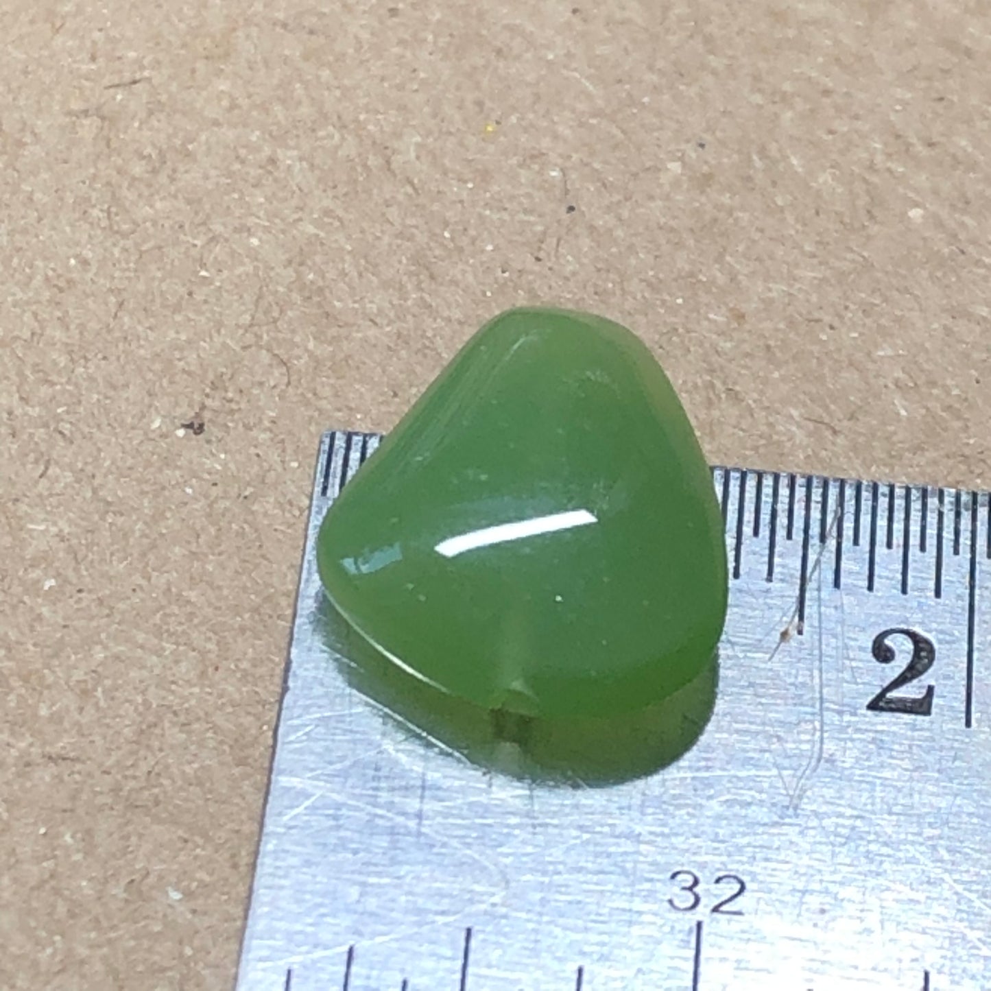 Opaque green peardrop glass beads