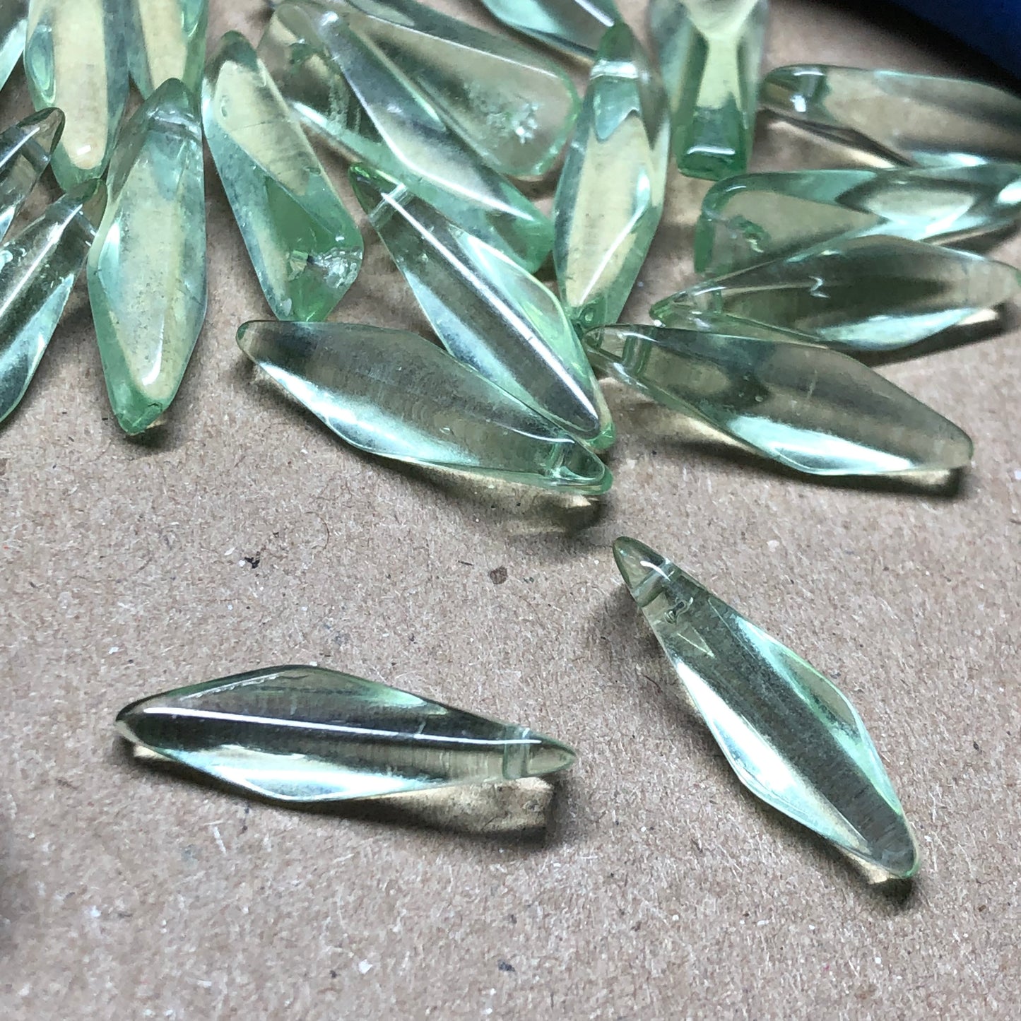 Green glass twisted dagger beads